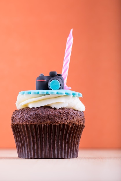 Delicious cupcake on table