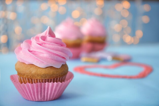 Delicious cupcake on table