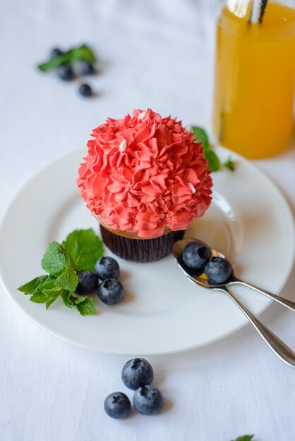 Delicious cupcake on a white plate