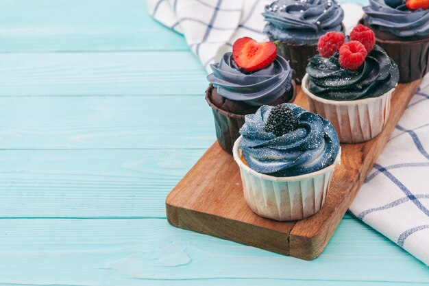 Delicious cupcakes on a colored. Festive, birthday