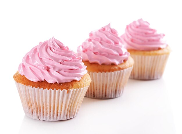 Delicious cupcakes isolated on white