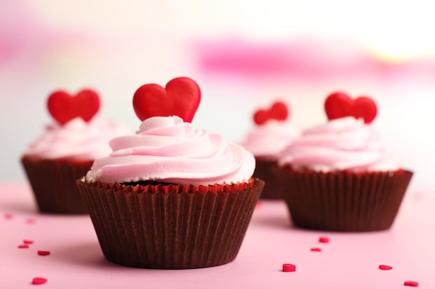 Delicious cupcakes for Valentine Day on bright background