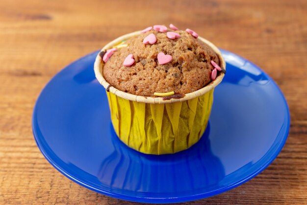 Delicious cupcakes with heart-shaped confectionery. Valentine gift