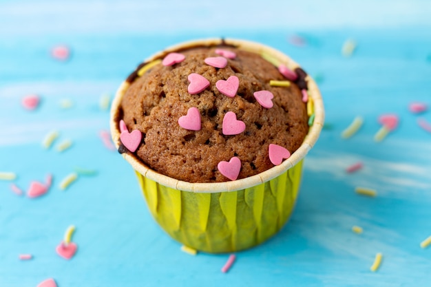 Delicious cupcakes with heart-shaped confectionery. Valentine gift