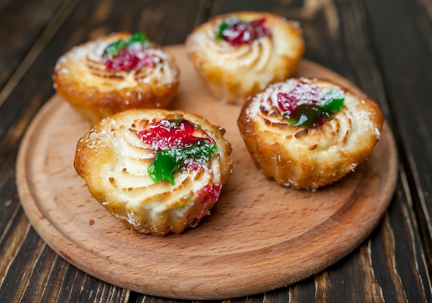 delicious cupcakes on wood background