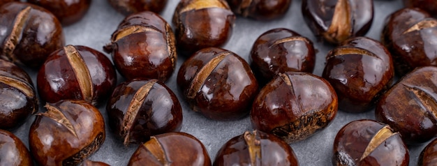 Delicious cut roasted chestnuts with oil and sugar, healthy eating snack in life, close up.