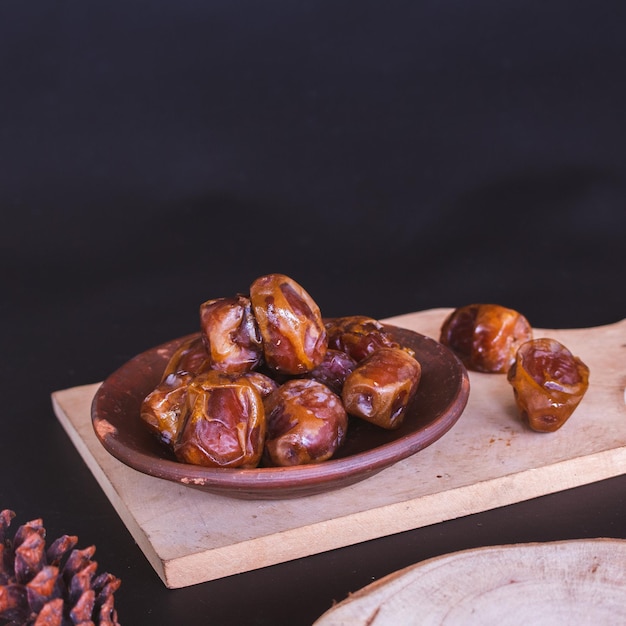 Delicious Date Fruit in a bowl. Bowl of dried dates.