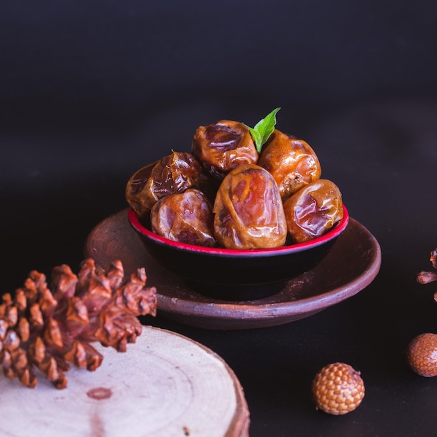 Delicious Date Fruit in a bowl. Bowl of dried dates.