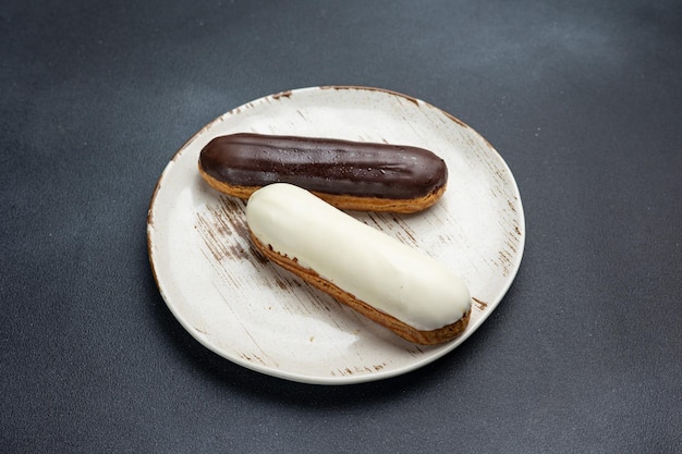 delicious dessert on a plate Black background Close up