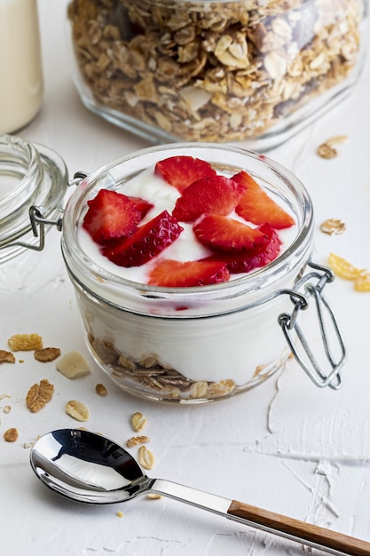 Delicious dessert of strawberries, yogurt and sugar-free cereals..