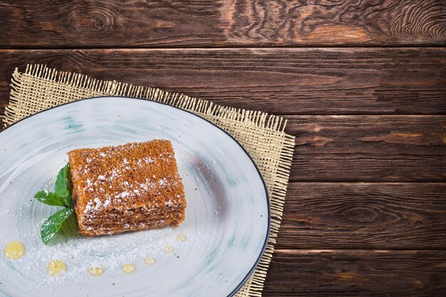 Delicious desserts on wooden background