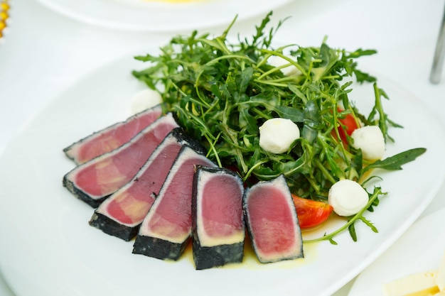 Delicious dish on the buffet table. Cold appetizers from the chef for the celebration