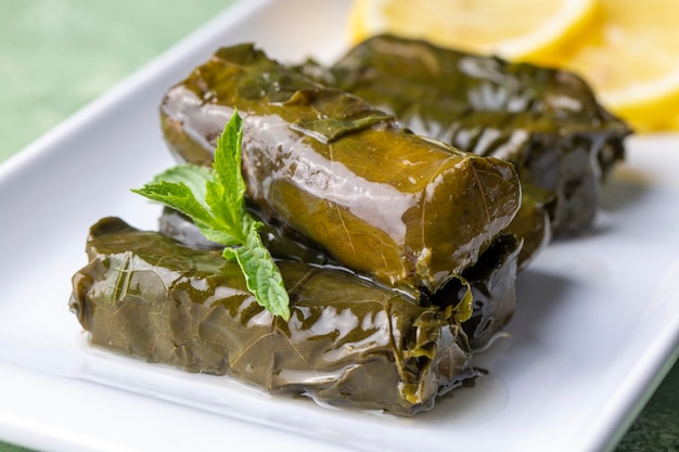 Delicious dolma sarma stuffed grape leaves rice Lebanese dolma sarma on plate Yaprak sarma