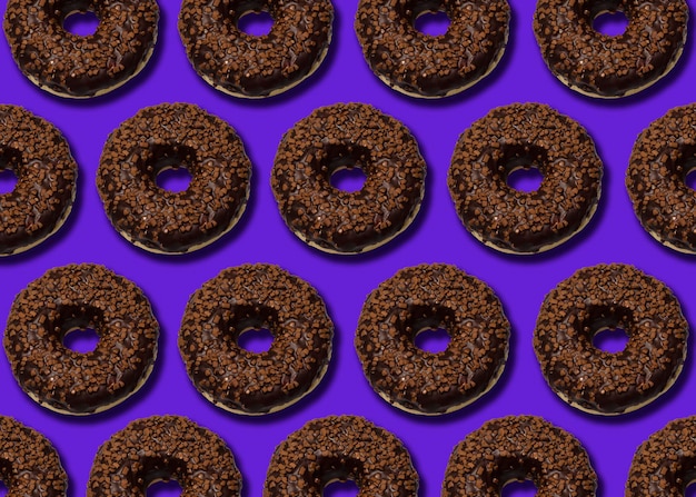 Delicious donut with dark chocolate isolated on blue background 2