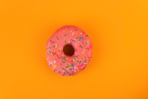 Delicious donut with pink icing