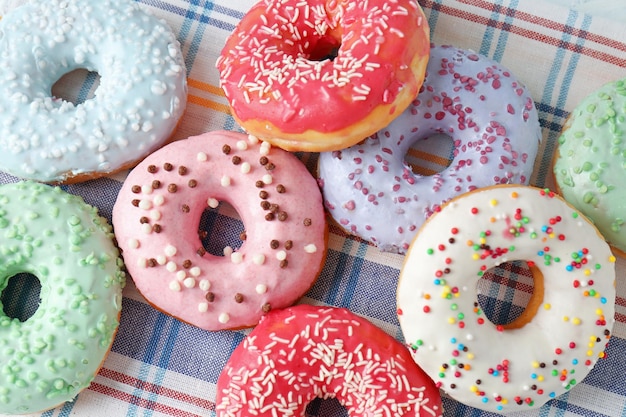 Delicious donuts on napkin closeup