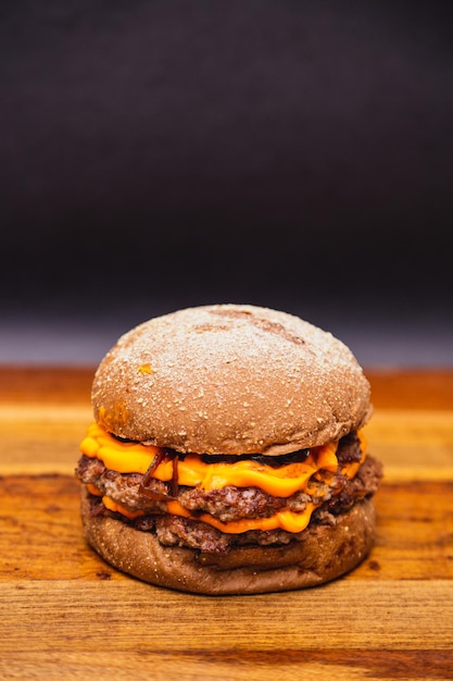 Delicious double beef burger with cheddar cheese and\
caramelized onions beef burger australian bread