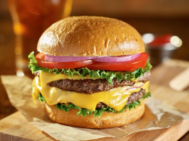 Delicious double cheeseburger on a wooden board