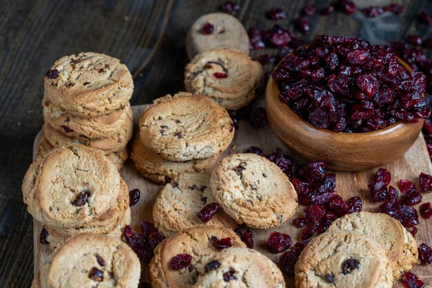 Delicious dried cookies made of highquality flour with dried red cranberries on the table