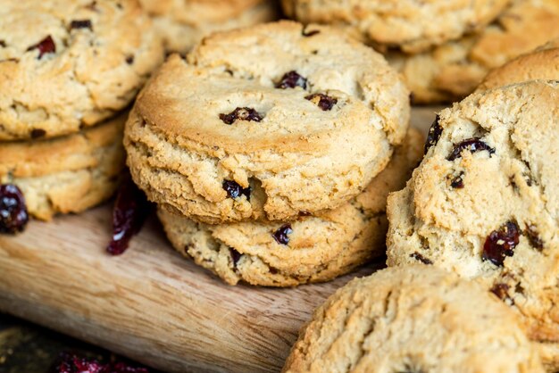 Delicious dried cookies made of highquality flour with dried red cranberries on the table