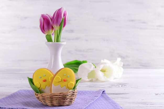 Delicious Easter cookies on table on light background