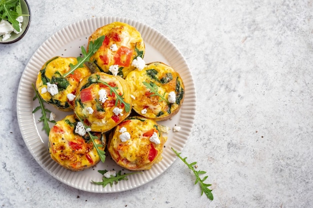 Delicious egg muffins with cheese and vegetables