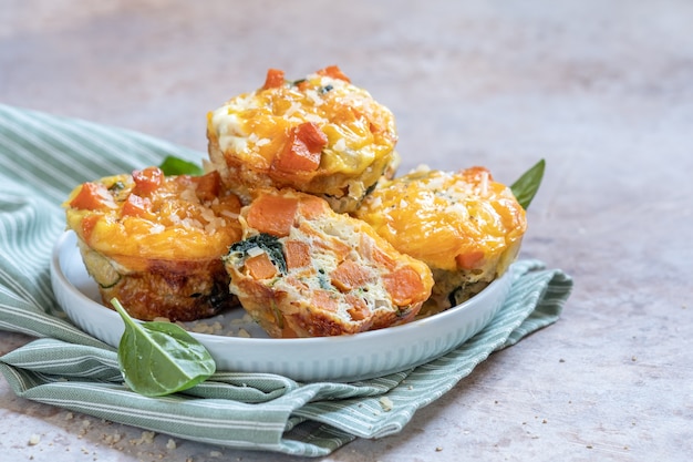 delicious egg muffins with sweet potato, spinach and onion