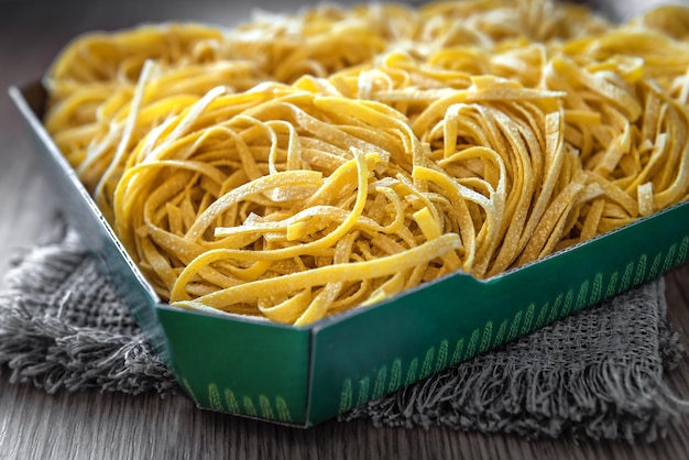 Delicious egg noodles fettuccine on the kitchen