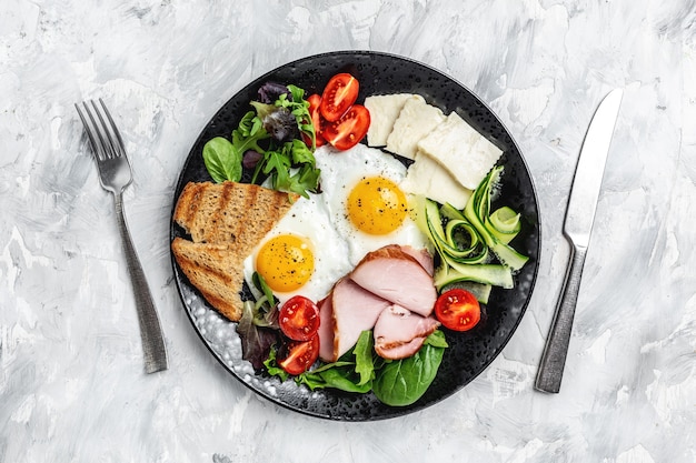 Delicious English Breakfast. Fried eggs with toast and bacon. Healthy breakfast. top view.