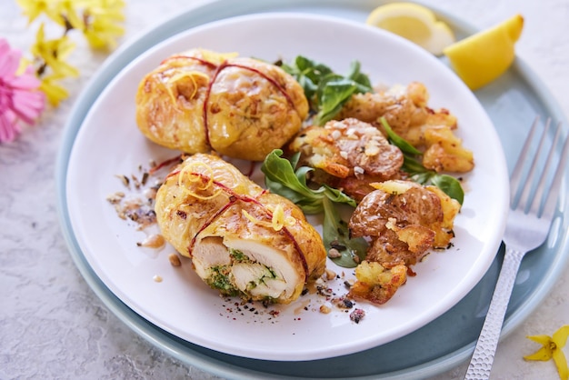 Delicious filled chicken thighs served on table