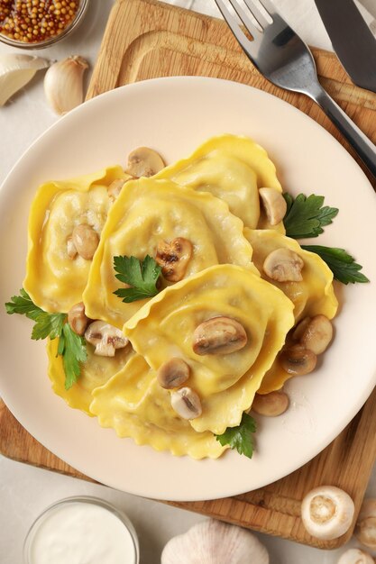 Delicious food concept with ravioli on textured table