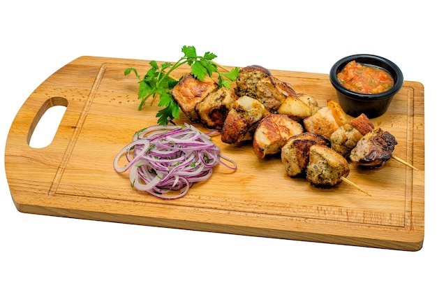 Delicious food on a wooden board on a white background