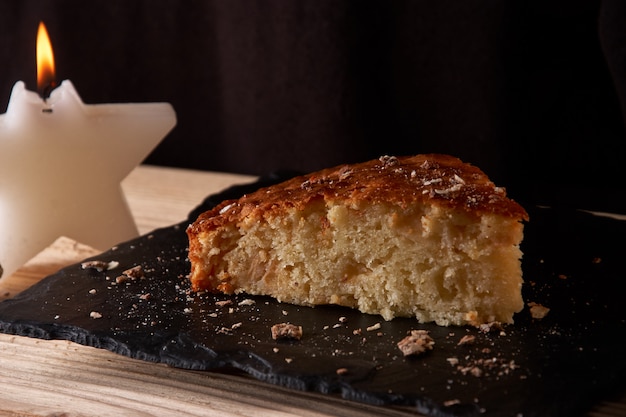 Delicious fresh baked piece of apple pie on shale board