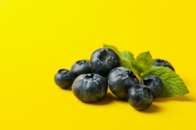 Delicious fresh blueberry on yellow