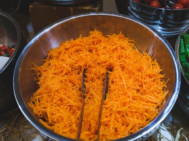 Delicious and fresh carrot salad in the pot