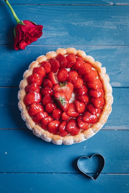 Delicious fresh Charlotte cake with strawberries and Savoiardi biscuits