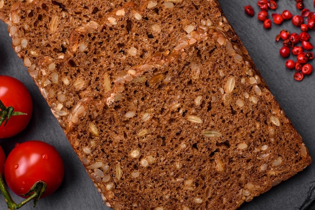 Delicious fresh crispy brown bread with seeds and grains cut into slices