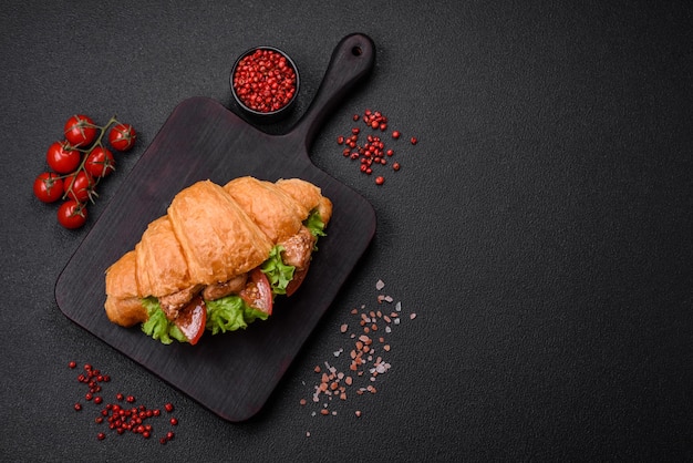 Delicious fresh crispy croissant with chicken or beef meat