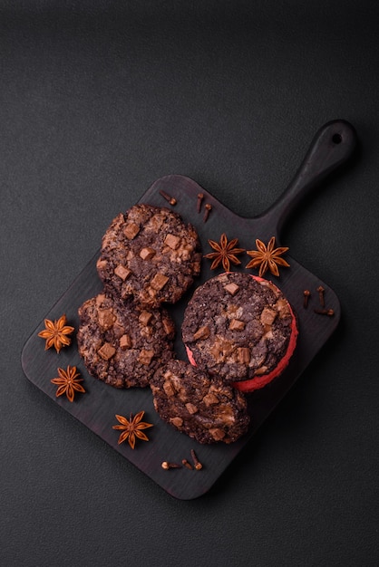 Delicious fresh crispy oatmeal cookies with chocolate and nuts