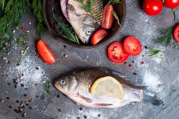 Delicious fresh fish on dark vintage background.