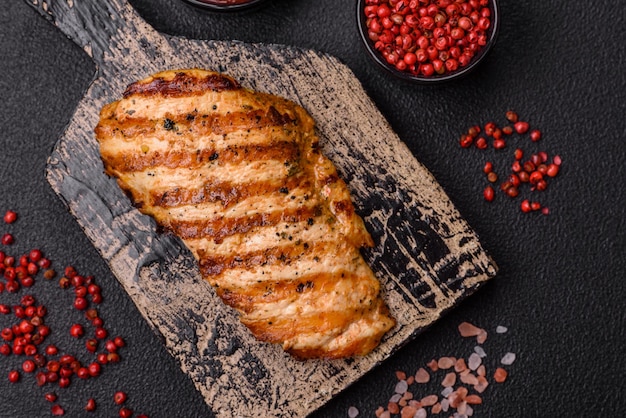 Delicious fresh grilled chicken fillet with spices and herbs