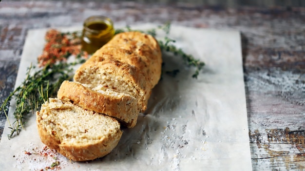 Delicious fresh homemade bread. Italian bread with herbs. Selective focus. 