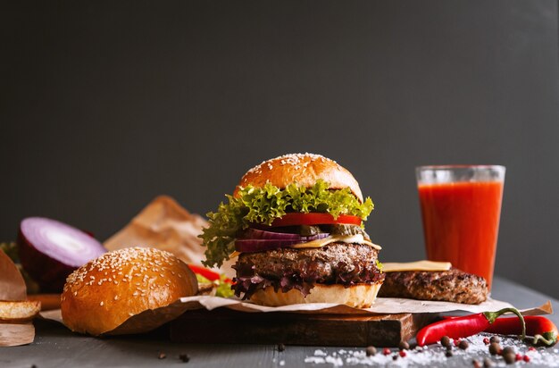 Delicious fresh homemade burger on a wooden table