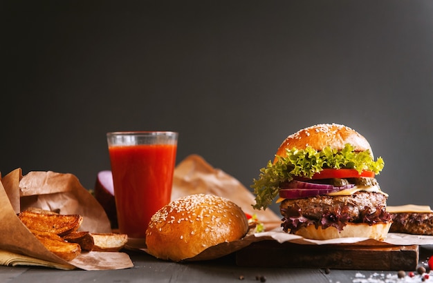 Delicious fresh homemade burger on a wooden table