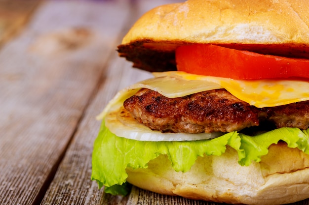 Delicious fresh homemade burger on a wooden table