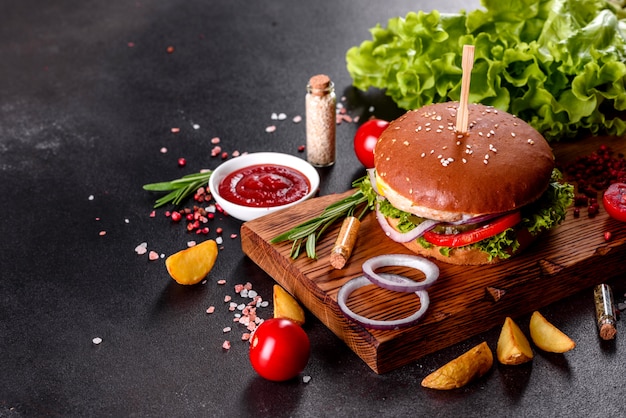 Delicious fresh homemade burger on a wooden table