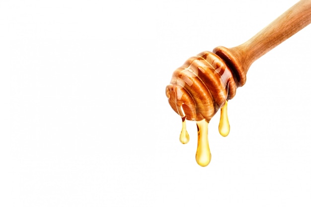 Delicious fresh honey dripping off the spoon.