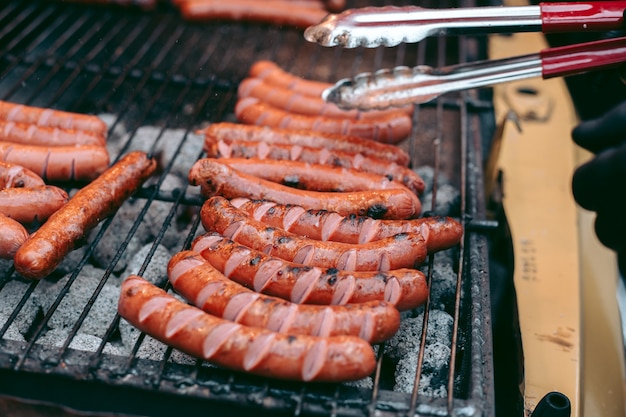 Delicious fresh hot dogs on the grill