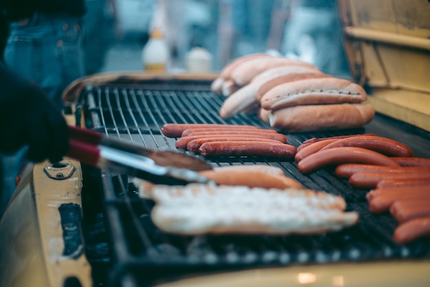 Delicious fresh hot dogs on the grill