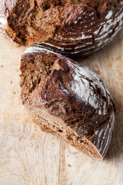 Delicious fresh loaf of bread, black rye bread with a crisp crust, fresh and soft rye bread made from rye and wheat flour